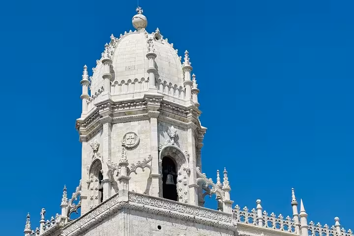 Marvel at the intricate details of the Jerónimos Monastery dome on a private tour in Belém, Lisbon.