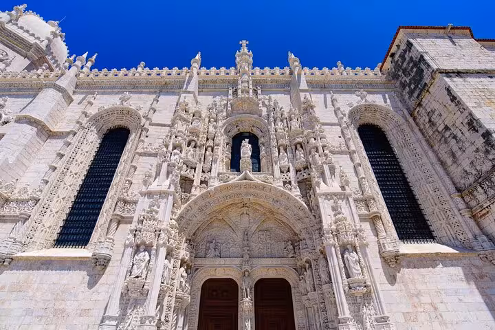 Explore the intricate façade of Jerónimos Monastery, a must-see on our full-day private tour in Lisbon.