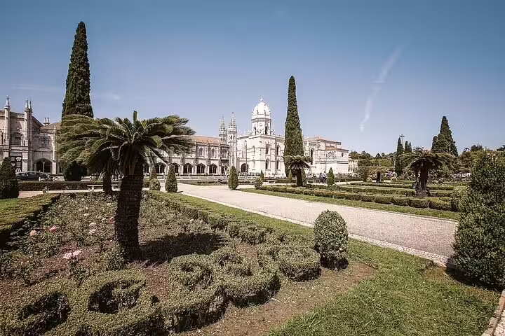 Explore the stunning Jerónimos Monastery gardens on a full-day private Lisbon tour by tuk tuk.