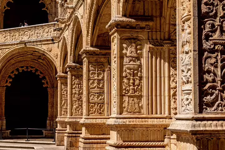 Intricate stone carvings at Jerónimos Monastery, a must-see stop on the Porto to Lisbon private transfer tour.