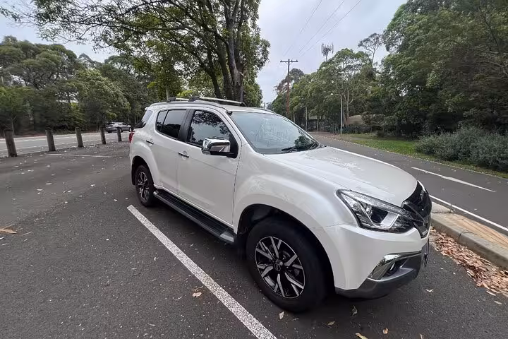 Comfortable white SUV used for Jervis Bay private tour, offering easy pickup and drop-off for a seamless journey.