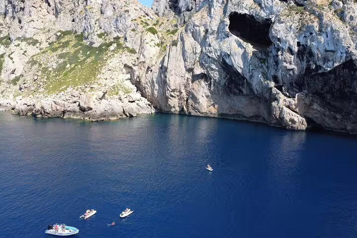 Aerial view of jet skis near Ibiza sea caves on the San Antonio to Es Vedrá guided excursion