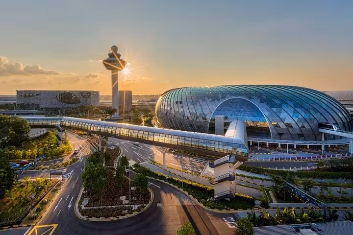 Exterior view of Jewel Changi Airport at sunset, gateway to Canopy Park admission ticket experience