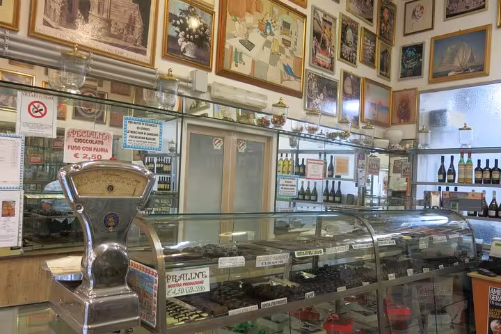 Inside a traditional Roman confectionery with vintage decor, highlighting Jewish influences on Roman sweets and cuisine.