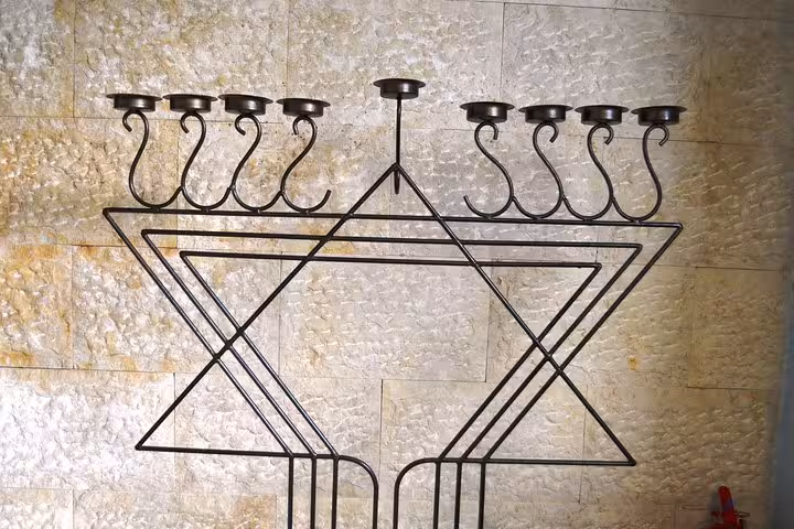 Large metal Star of David menorah display in Manaus synagogue, highlight of Jewish heritage tour