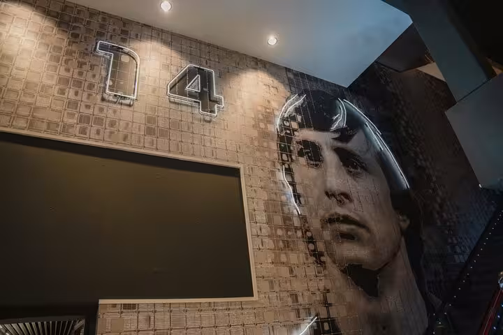 Johan Cruijff Arena interior mural of Johan Cruijff number 14, a highlight on Amsterdam Ajax tour