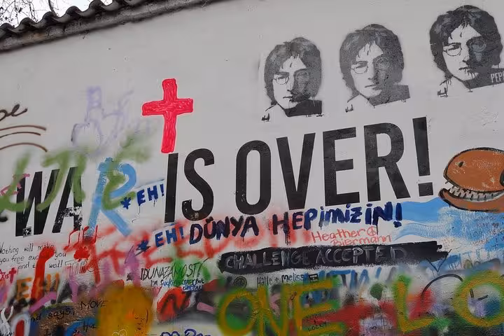 John Lennon Wall graffiti in Prague, colorful street art stop on a private day trip from Vienna