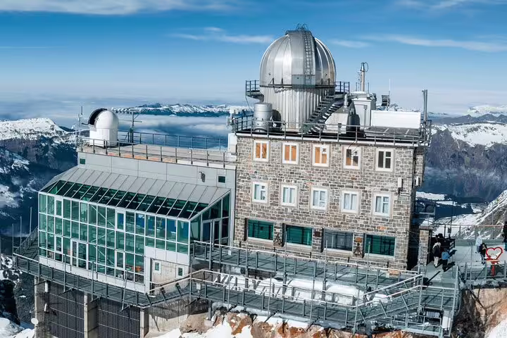 Visit the iconic observatory on Jungfraujoch, offering panoramic Alpine views on a private day trip to the Top of Europe.