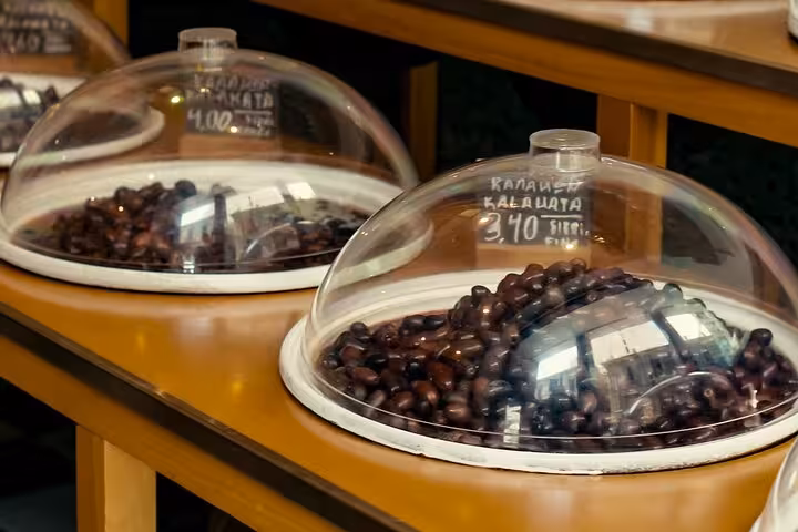 Close-up of Kalamata olives at a Greek deli tasting stop on a small group Athens walk and taste for cruisers