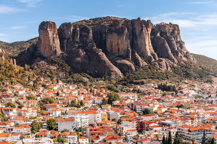 Kalambaka town beneath Meteora cliffs, scenic stop on Thessaloniki to Meteora private day tour with local