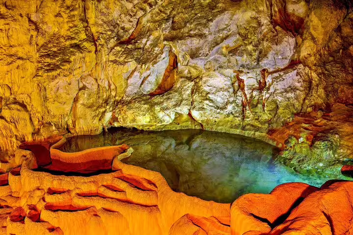Underground lake and rock formations inside Cave of Lakes, highlight of the Kalavryta full-day tour