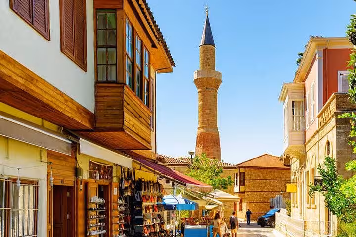 Kaleici old town street with shops and minaret in Antalya, colorful highlight of all-inclusive city tour
