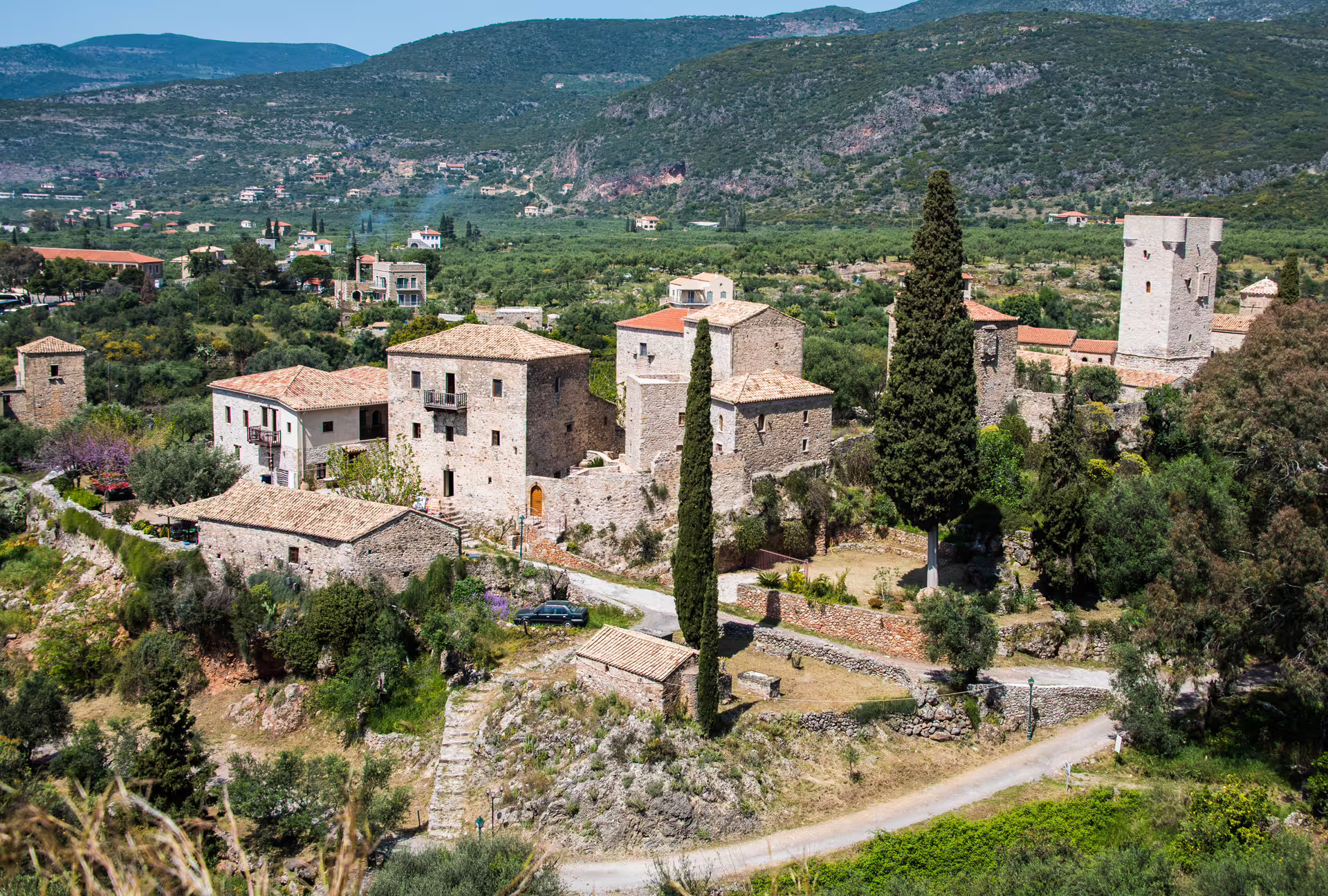 Traditional stone tower houses in Old Kardamyli village, Mani Peninsula, scenic stop on guided hiking tour