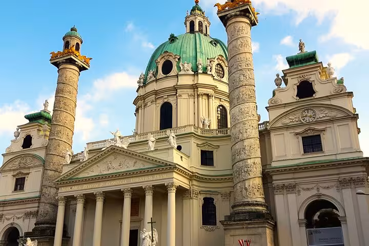 Karlskirche in Vienna with green dome and columns, a highlight on an In Vienna by public transport tour