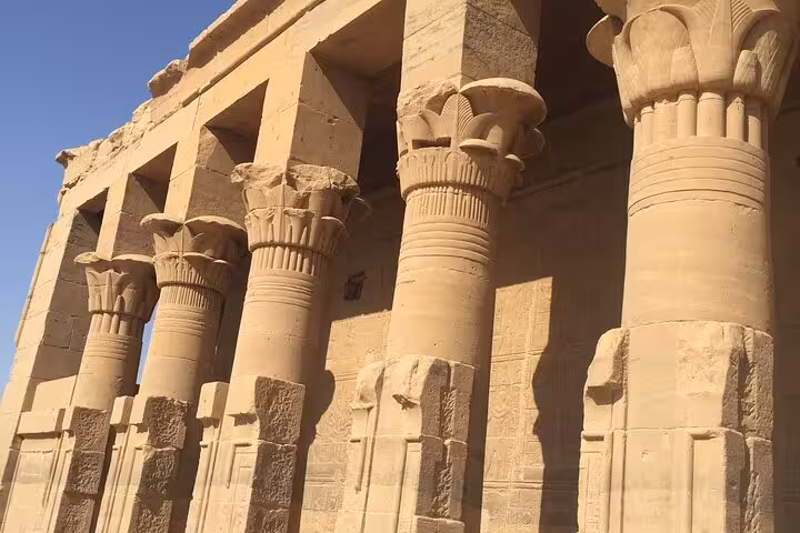Karnak Temple columns in Luxor on Hurghada day trip, ancient Egyptian carvings and sandstone pillars