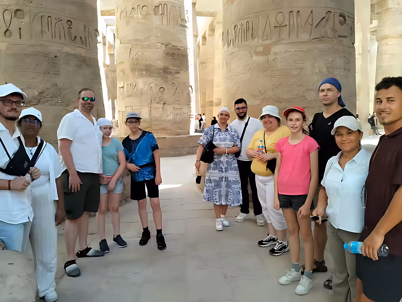Visitors inside Karnak Temple columns, Luxor sightseeing on Hurghada tour to Valley of the Kings and Tutankhamun
