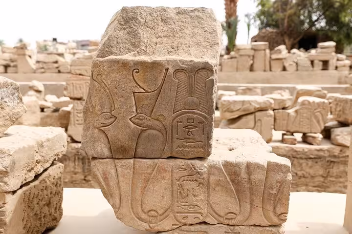 Carved hieroglyphic stone block at Karnak Temple, highlight stop on a private Luxor day tour with guide