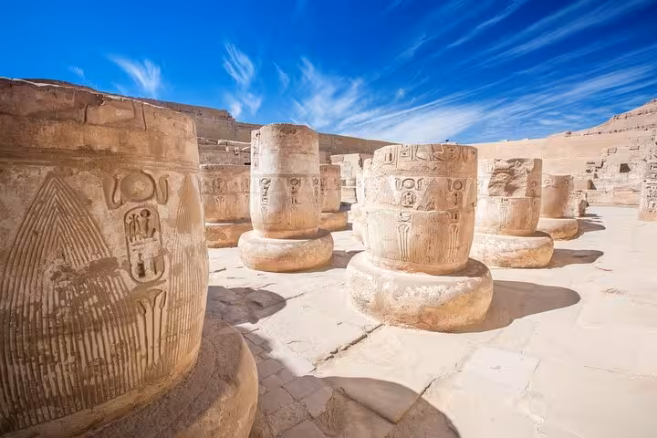 Carved stone columns with hieroglyphs at Karnak Temple, Luxor 2-day tour from Hurghada with Nile boat