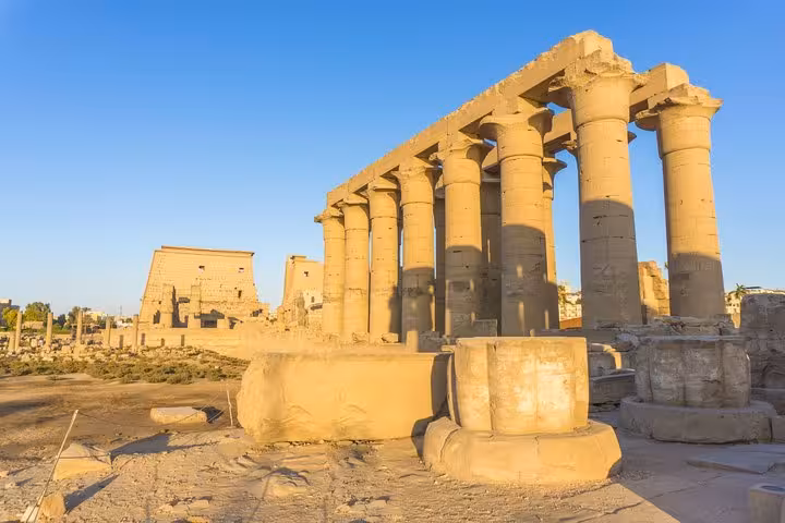 Karnak Temple hypostyle columns in golden light, must-see stop on Luxor ancient wonders guided tour Egypt