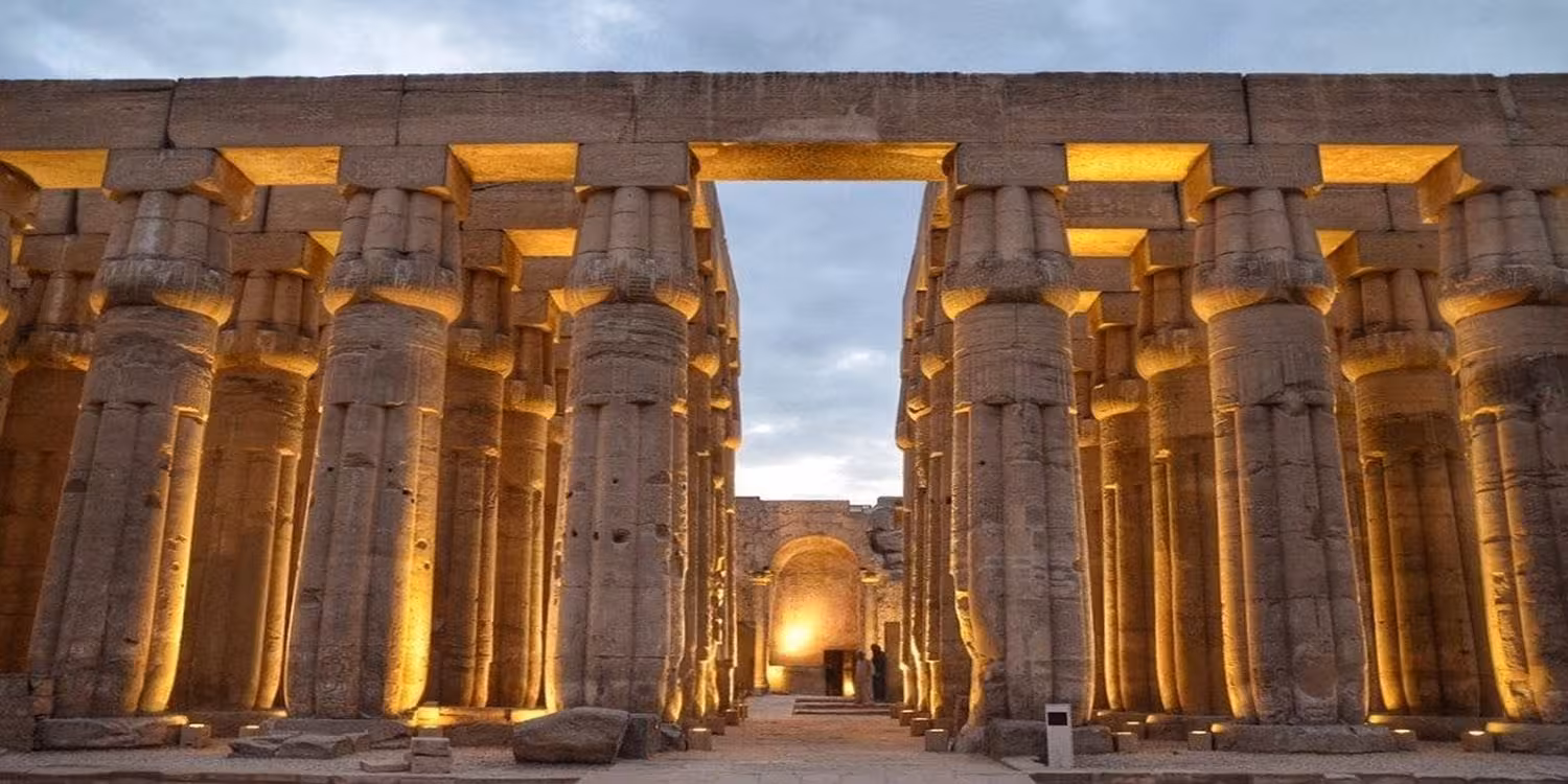 Illuminated Great Hypostyle Hall columns at Karnak Temple during the Luxor sound and light show tour