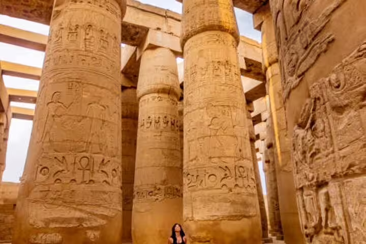 Karnak Temple hypostyle hall columns with hieroglyphs on a Luxor day tour to Valley of the Kings