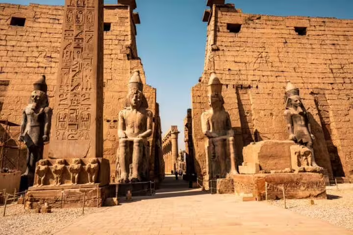 Karnak Temple entrance in Luxor with colossal statues and hieroglyphs on guided day tour