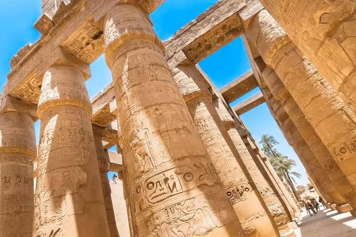 Karnak Temple columns with hieroglyphs on Luxor day trip by plane from Sharm El Sheikh