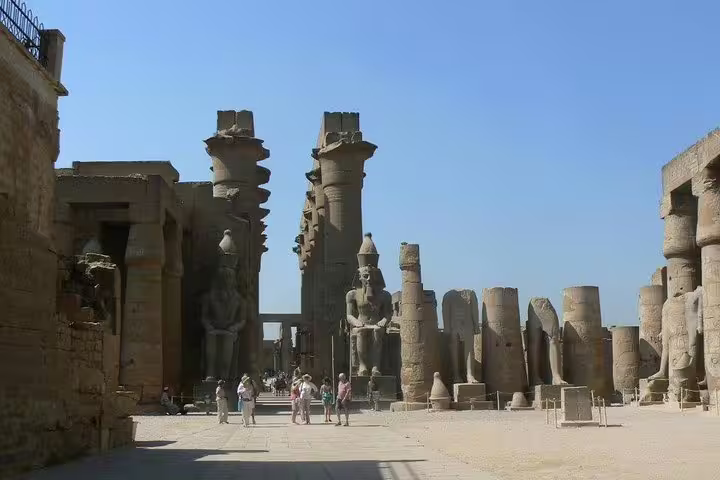 Wide view of Karnak Temple complex with columns and statues, popular stop on full-day Luxor tour
