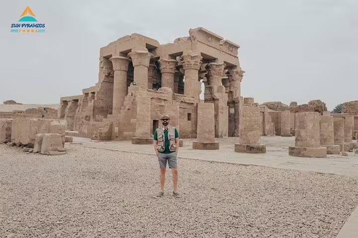 Tourist at Karnak Temple columns in Luxor, part of 12 day 11 night Egypt itinerary with Pyramids and Aswan