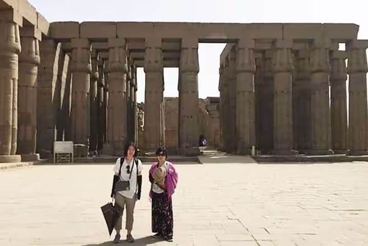 Tourists at Karnak Temple columns, Luxor on 12 day 11 night Egypt itinerary with Pyramids, Aswan and Hurghada
