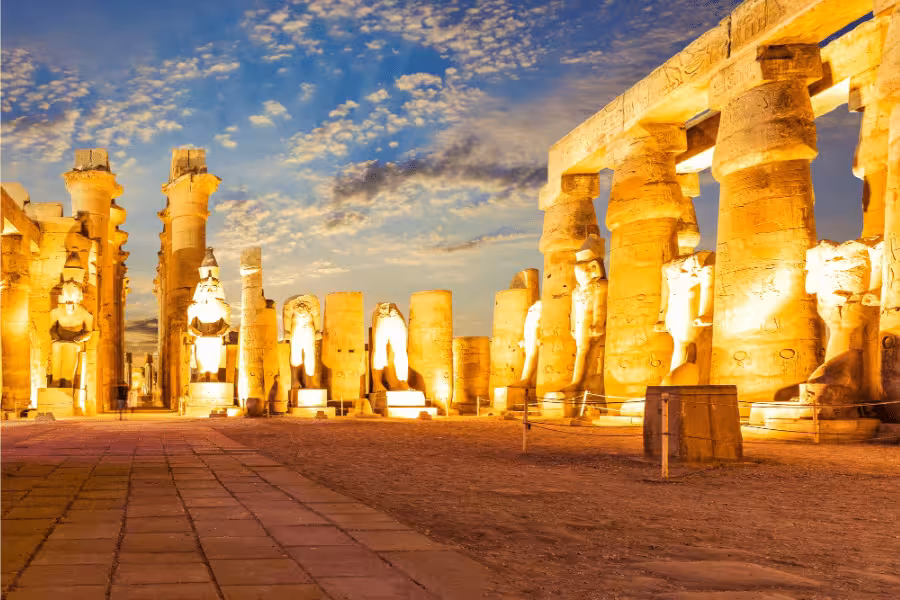Illuminated Karnak Temple at night in Luxor, ancient pharaohs site on 15-day Egypt tour from Red Sea to Nile