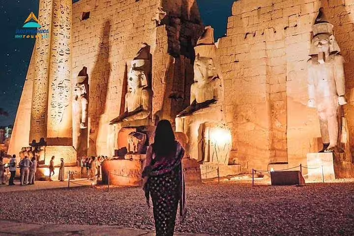 Night view of Karnak Temple statues and obelisk in Luxor, highlight of Cairo Luxor Aswan Petra tour