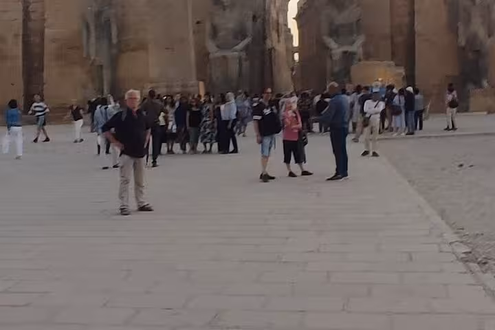 Tourists exploring Karnak Temple avenue on a full-day private guided Luxor tour from Hurghada