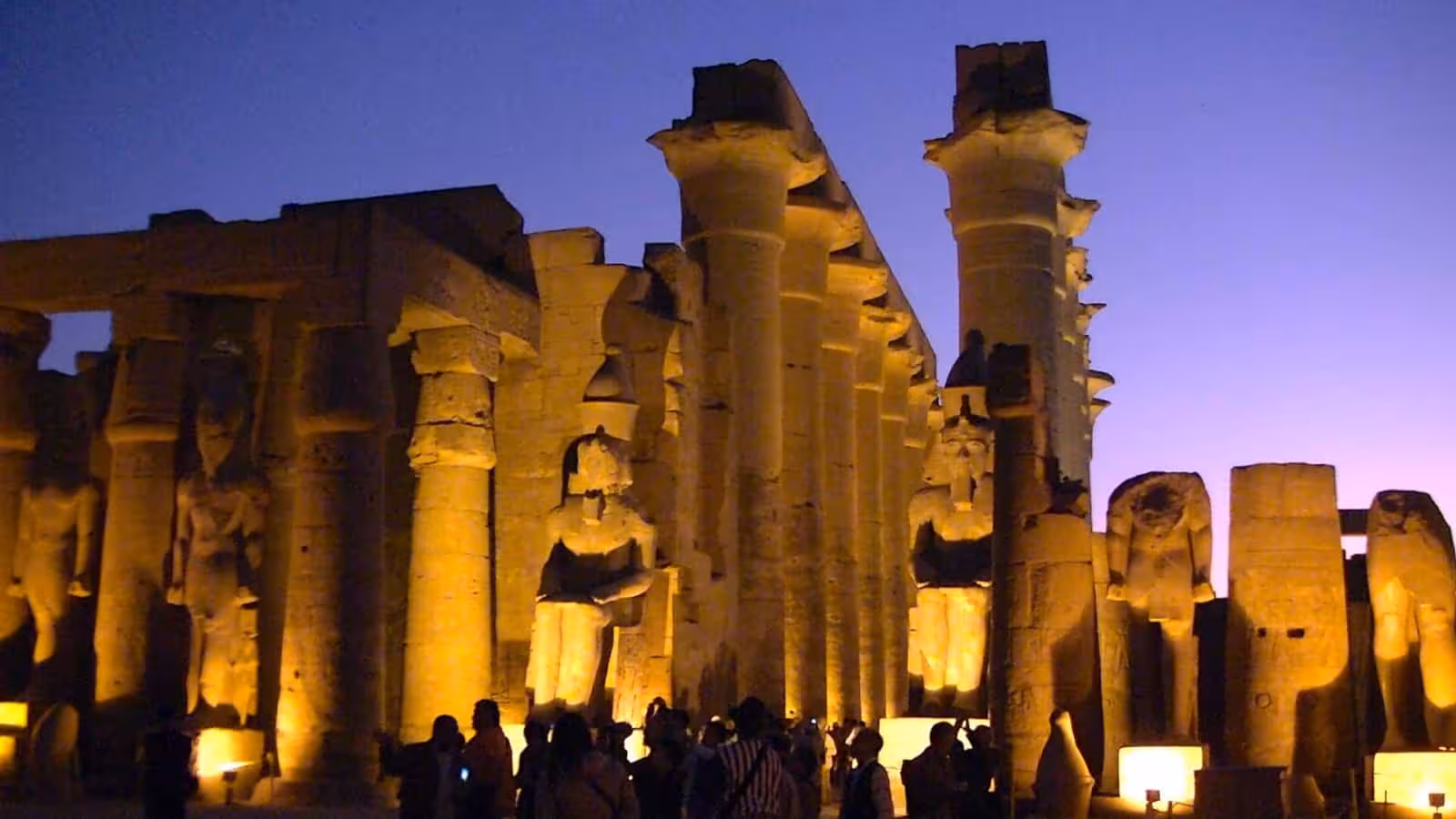 Karnak Temple night show in Luxor with illuminated columns and statues during sound and light tour