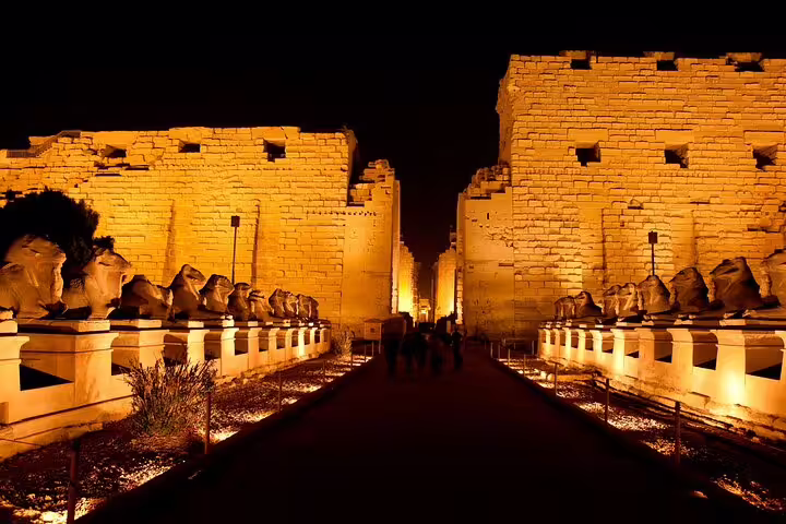 Karnak Temple entrance avenue glowing at night, iconic Sound and Light Show experience on Luxor day tour