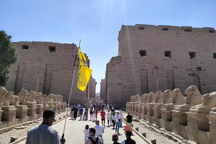 Karnak Temple avenue of ram-headed sphinxes in Luxor, guided visit on 14-day Egypt Nile Sahara desert bus tour