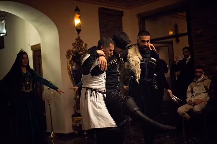 Caucasian dance trio performs in Kars cultural house during an all-inclusive private guided Kars City tour