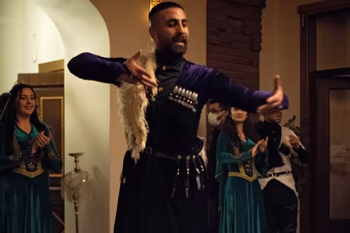 Male dancer in traditional Caucasian costume performs in Kars on an all-inclusive private guided city tour