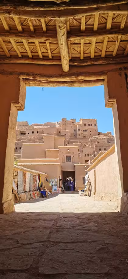 View through kasbah gateway to Ait Benhaddou clay village, a highlight on Best of Morocco tours