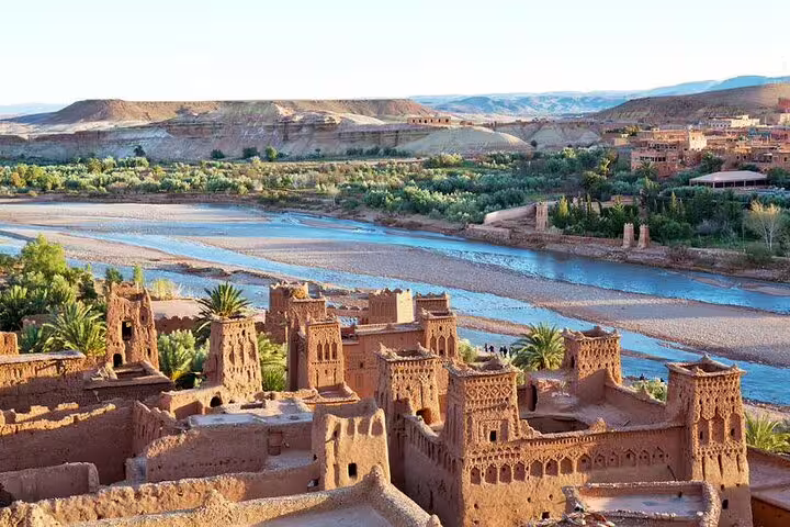 Ait Benhaddou-style kasbah above the river valley on a private 2-day desert tour from Marrakech to Zagora