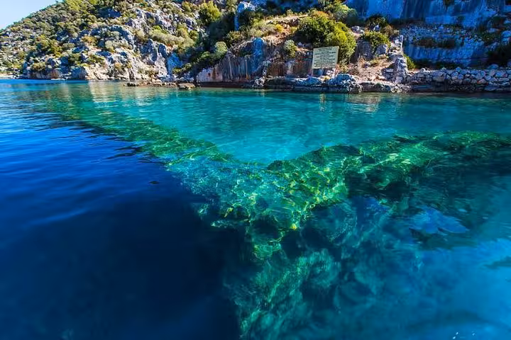 Crystal-clear Kekova sea over sunken ruins, highlight stop on Myra St Nicholas Church boat tour