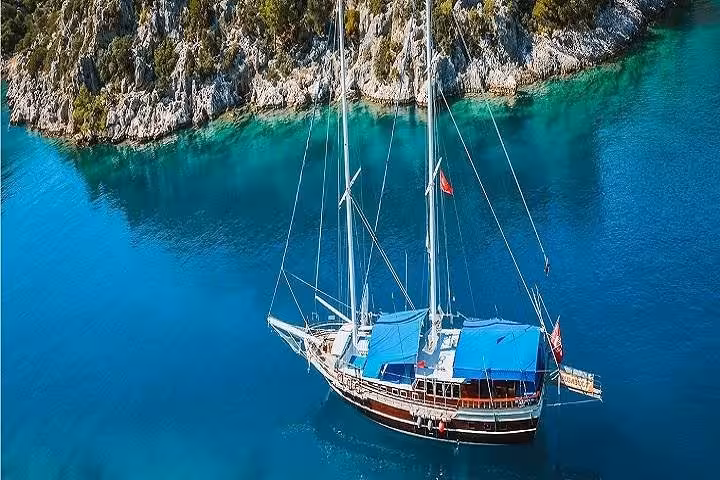 Gulet boat cruising Kekova turquoise bay on Myra St Nicholas Church tour, Antalya coast scenery