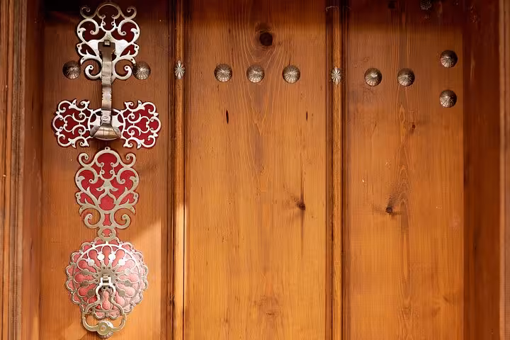 Close-up of ornate Ottoman-style door knocker on Kemaliye wooden door, Erzincan to Kemaliye 2-day tour