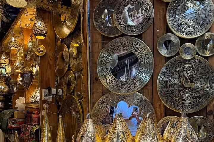 Khan El Khalili bazaar brass plates and lanterns in Cairo, a stop on a 3-day private Giza tour