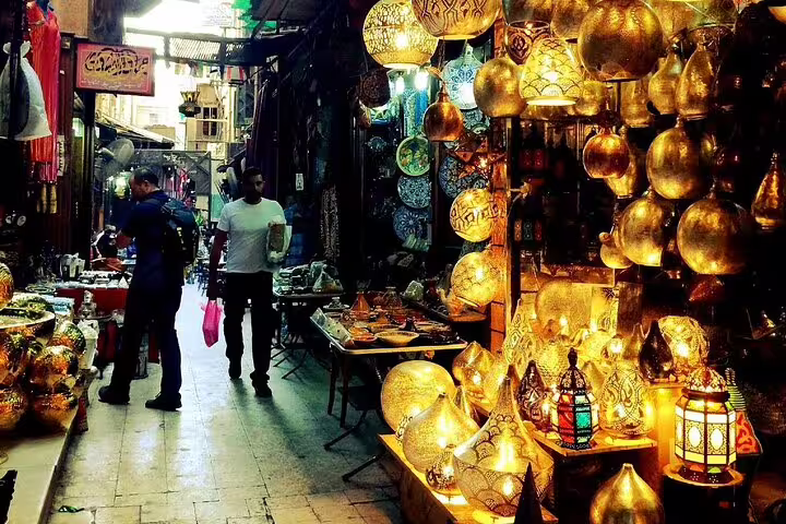 Lantern-lit alley in Khan El Khalili Bazaar, Cairo, on Port Said tour to Pyramids, Citadel and bazaar