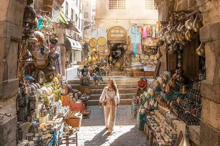 Khan El Khalili bazaar alley in Cairo with brassware and lanterns on Port Said pyramids tour stop