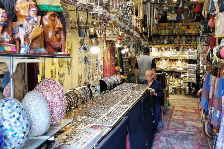 Jewelry and mosaic lamps inside a Khan el-Khalili bazaar shop on a Medieval Cairo shopping tour