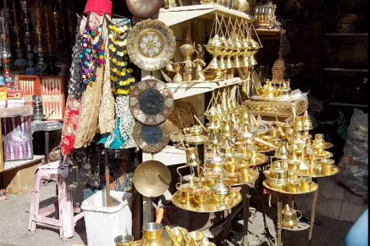 Khan el-Khalili shop display of brass trays and lanterns, ideal for Medieval Cairo shopping tour