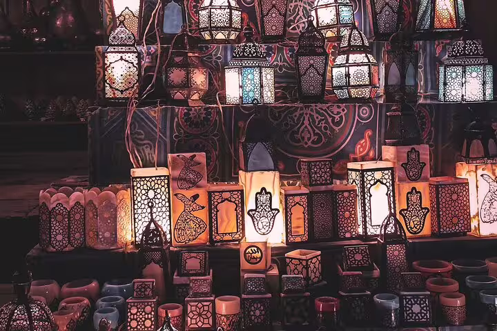 Handmade Ramadan lanterns and candle holders lit at night in Khan El Khalili, Medieval Cairo bazaar tour
