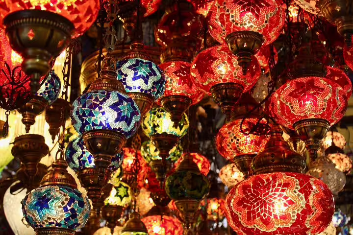 Colorful mosaic lanterns glowing in Khan El Khalili Bazaar, Cairo night market shopping tour Egypt